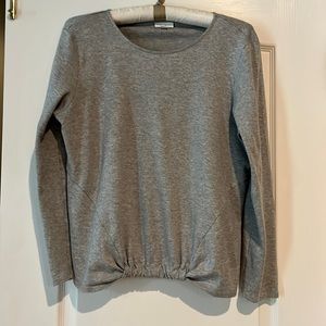 JJill lightweight long sleeved knit top with gathering along the bottom front.